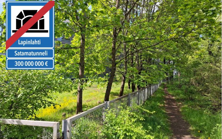 Kuva vehreästä puistopolusta. Vasemmassa yläkulmassa on liikennemerkkiä muistuttava merkki, jossa satamatunnelin yli on vedetty punainen viiva