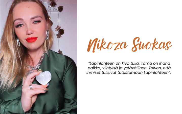 Kuvassa vaalea nainen, jolla kädessä sydänheijastin.